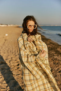 Young woman standing on beach