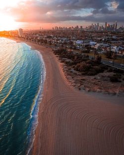 Aerial view of city at sunset