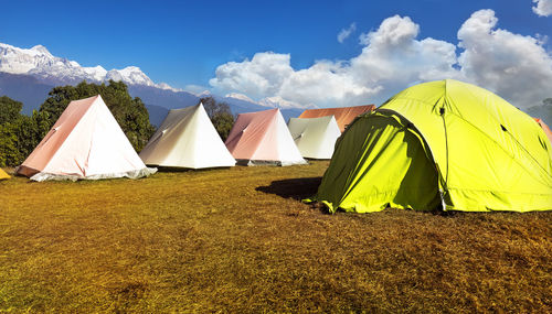 Tent on field against sky