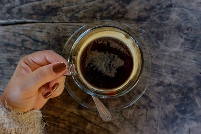 Close-up of woman hand holding drink