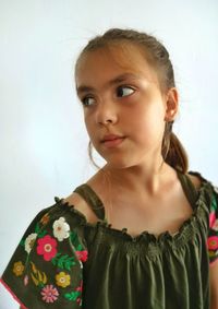 Thoughtful girl against white background