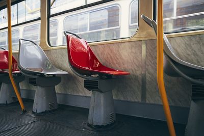 Empty seats in old tram of public transportation.