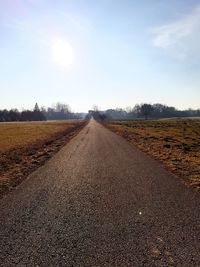 Road on field against sky