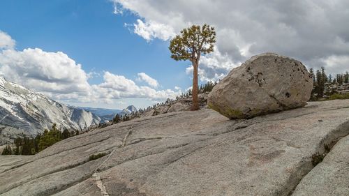 Scenic view of mountains against cloudy sky