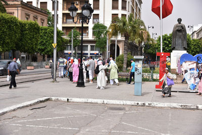 People walking on street in city