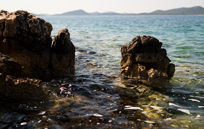 Rock formation on sea shore against sky, croatia