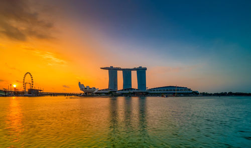 View of bridge over sea against sky during sunset