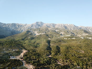 Scenic view of mountains against clear blue sky