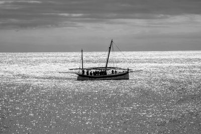 Boat in sea against sky