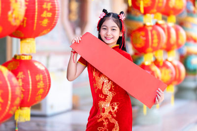 Portrait of smiling young woman in traditional clothing