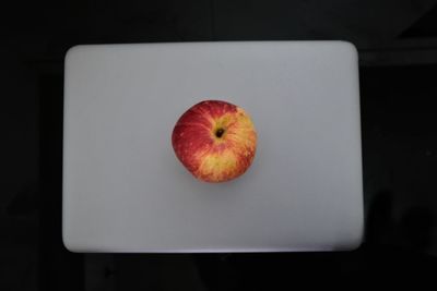 High angle view of apple on table against black background