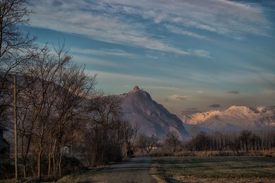 Scenic view of mountains against cloudy sky