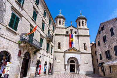 Low angle view of buildings in city against sky