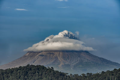 Scenic view of volcanic mountain against sky