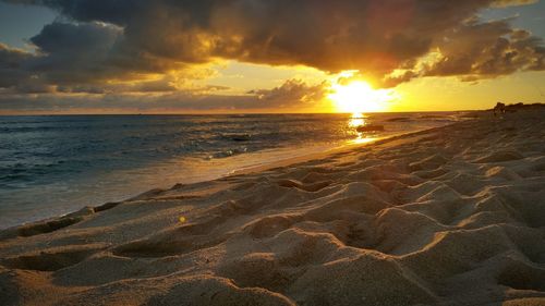 Scenic view of sea at sunset