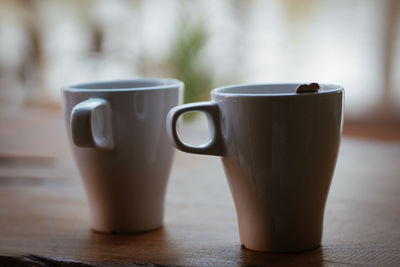 Close-up of coffee cup on table