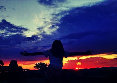 Silhouette of people at sunset