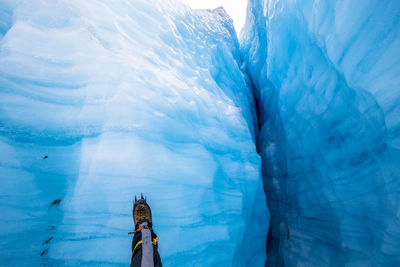 Low section of person on glacier