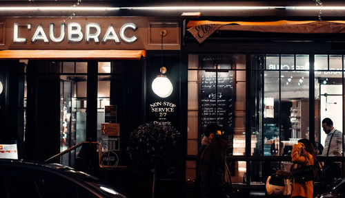 Group of people on illuminated restaurant