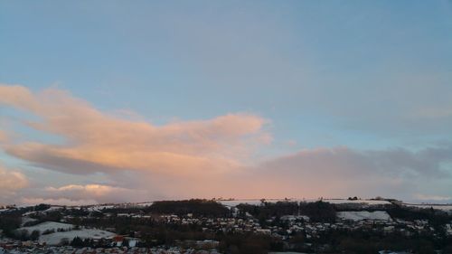 Townscape against sky during sunset