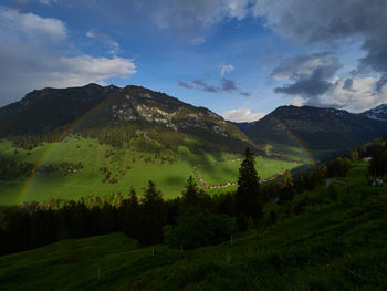 Scenic view of landscape and mountains against sky