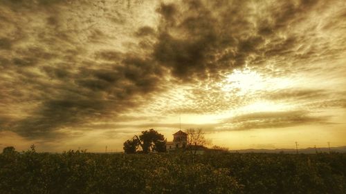 Scenic view of landscape against cloudy sky