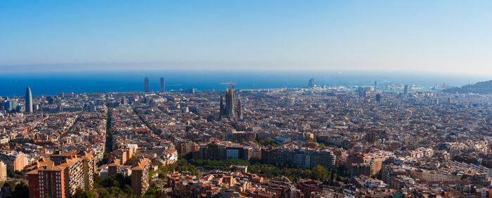 Panoramic view of barcelona with sagrada familia and mediterranean sea