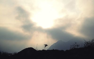 Low angle view of silhouette mountain against sky during sunset