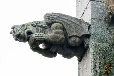 Close-up of statue against white background