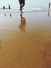 Low section of people on beach