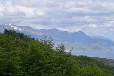 Scenic view of mountains against cloudy sky