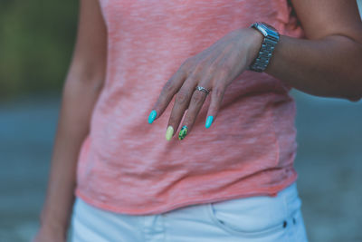 Midsection of couple holding hands