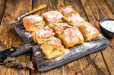 High angle view of bread on cutting board