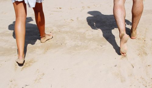 Low section of people walking on footpath