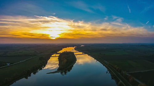 Scenic view of landscape against sky during sunset