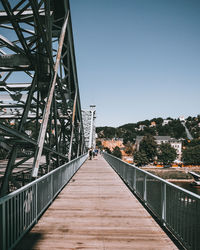 Footbridge against clear sky