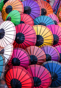 Full frame shot of multi colored umbrellas at market