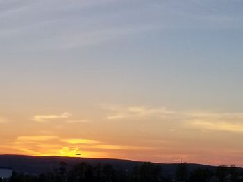 Scenic view of silhouette landscape against sky during sunset