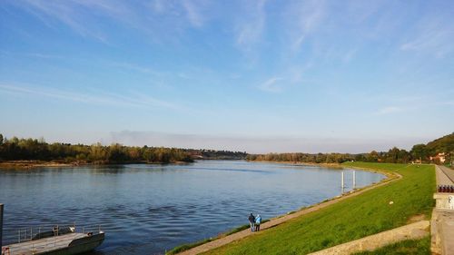 Scenic view of lake against blue sky