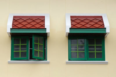 Reflection of building on glass window