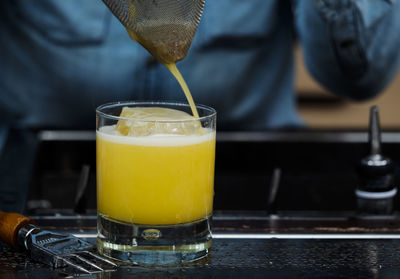 Close-up of yellow drink on table