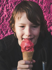 Close-up portrait of a boy eating ice cream