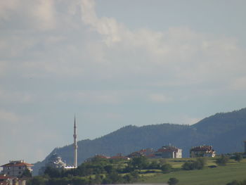 View of buildings against cloudy sky