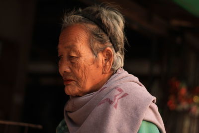 Close-up of senior woman looking away.