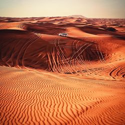 Aerial view of desert against clear sky