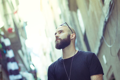 Portrait of young man looking away
