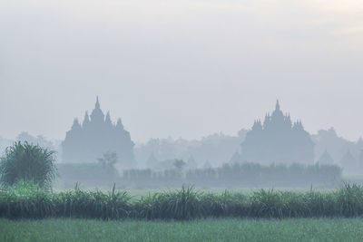 Panoramic view of temple and buildings against sky