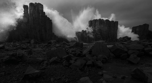 Panoramic view of rocks on land against sky