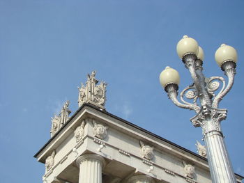 Low angle view of statue against building