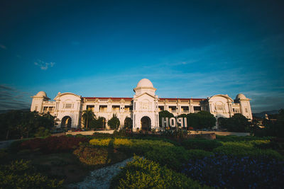 Scenic view of building against blue sky